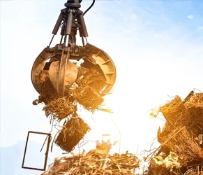 Efficient Waste Management for Sustainable Construction. Excavator claw lifting construction waste for sorting and recycling.