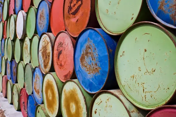 Industrial Barrels Representing Toxic Waste. Rusty metal barrels illustrating hazardous waste storage.
