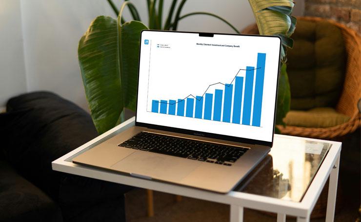 Laptop screen showing business growth and cleantech investment data.